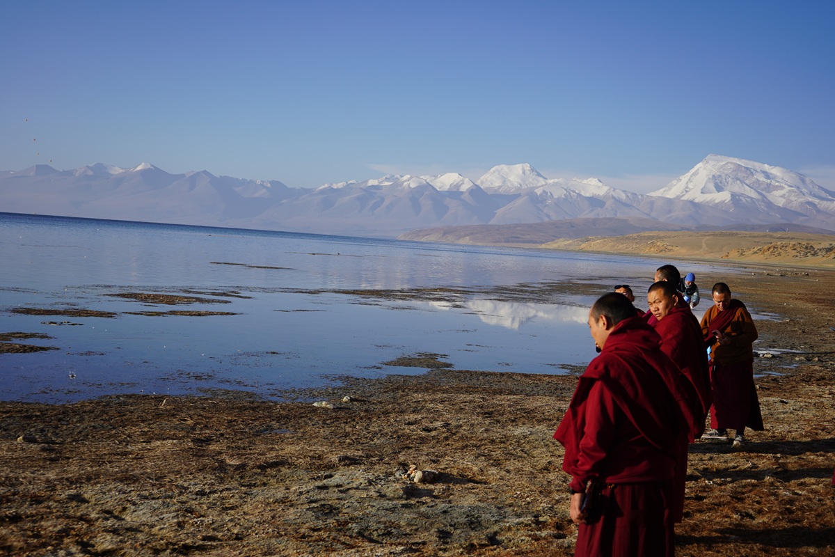 Monks Performing Rituals in Front of Mansarovar Lake